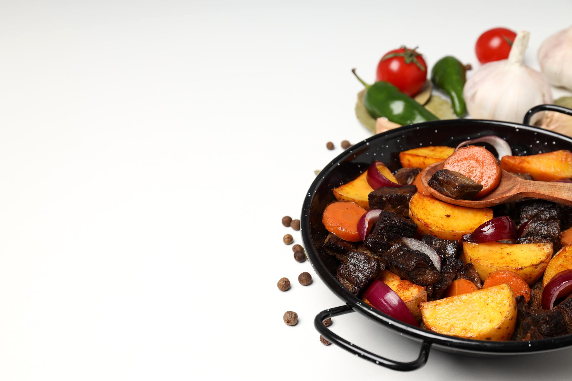 Close-up of sizzling pan with vegetables